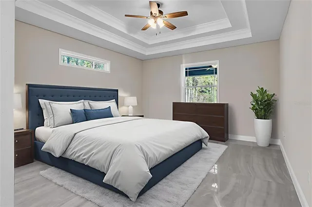 a bedroom with bed and a potted plant