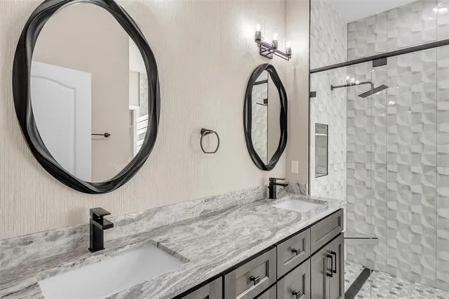 a bathroom with a sink and a mirror