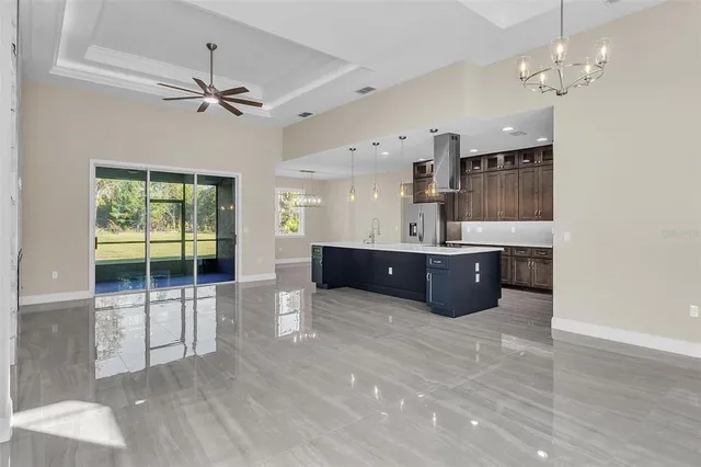 a spacious bathroom with a sink a large mirror and vanity