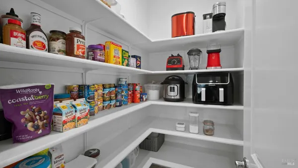 a kitchen with stainless steel appliances granite countertop a stove a microwave and cabinets