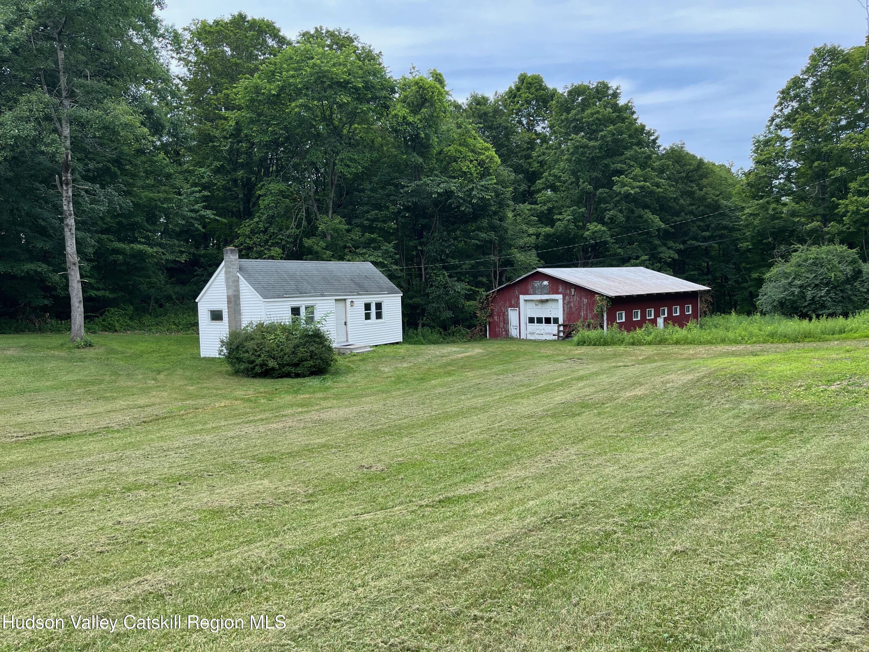 601 Fischer Road Kinderhook, NY 12106 - Photo 1 of 13 a front view of a house with garden