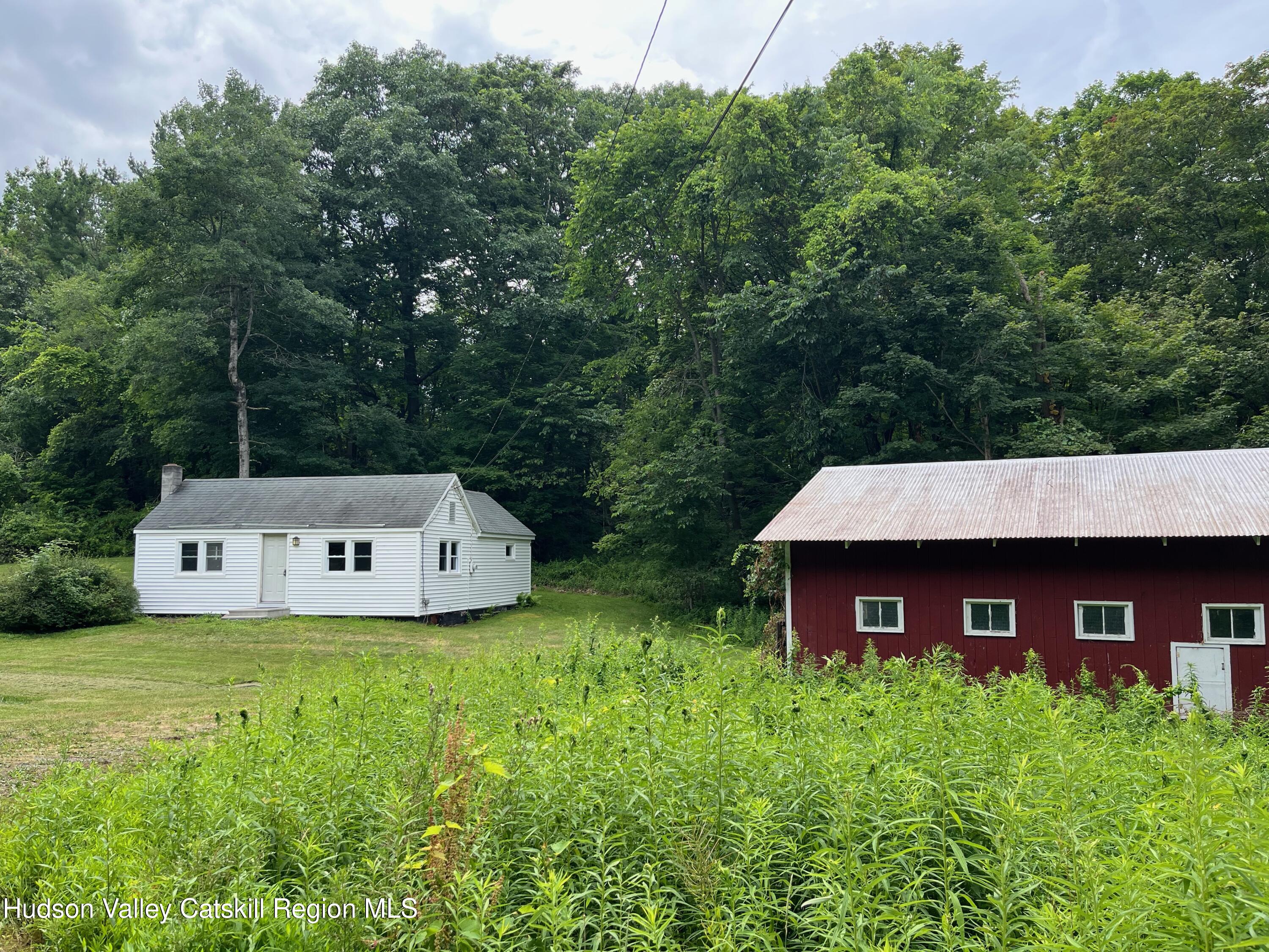 601 Fischer Road Kinderhook, NY 12106 - Photo 13 of 13 a view of a wooden house with a yard