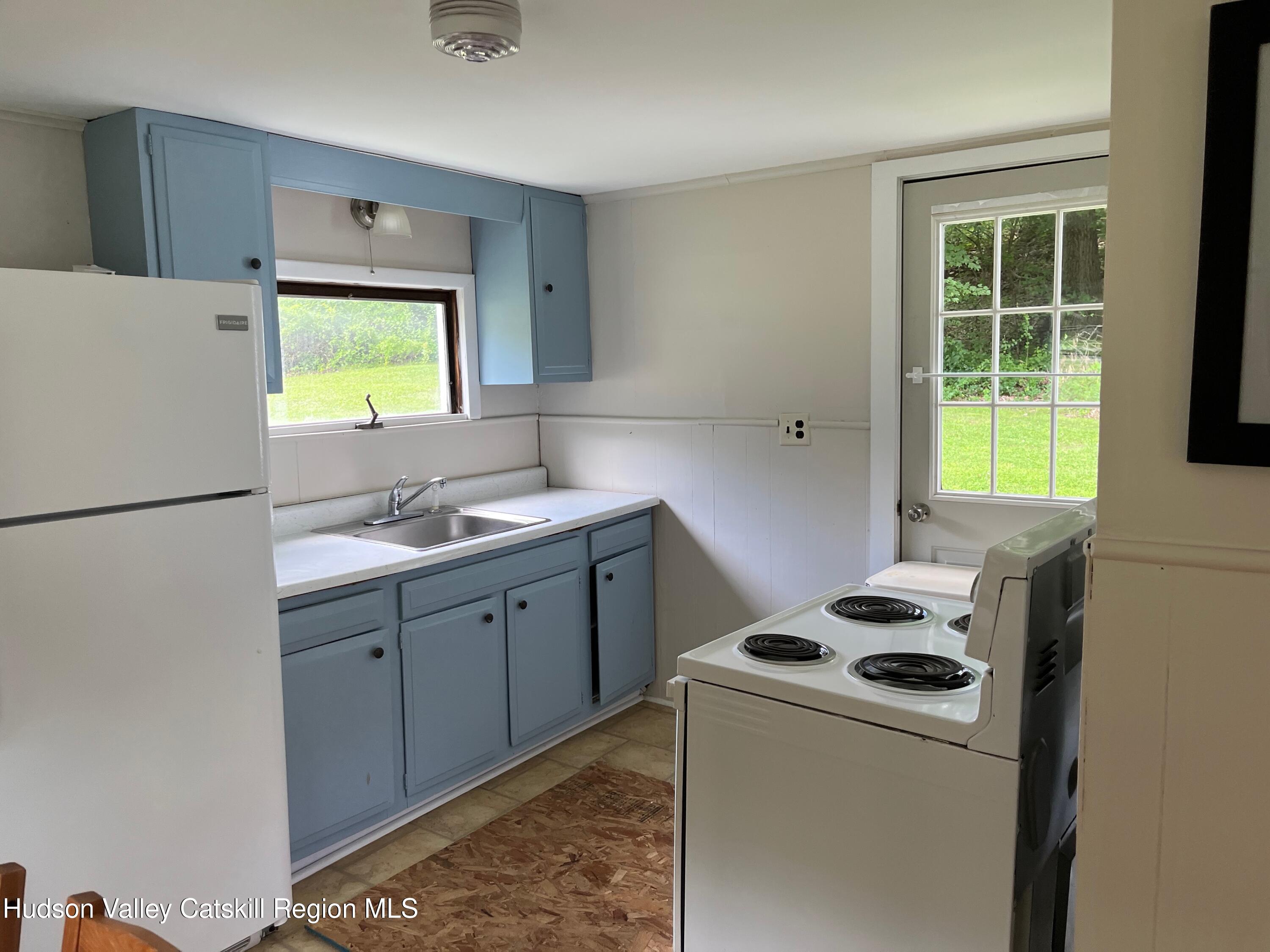 601 Fischer Road Kinderhook, NY 12106 - Photo 2 of 13 a kitchen with a refrigerator sink and a stove top oven