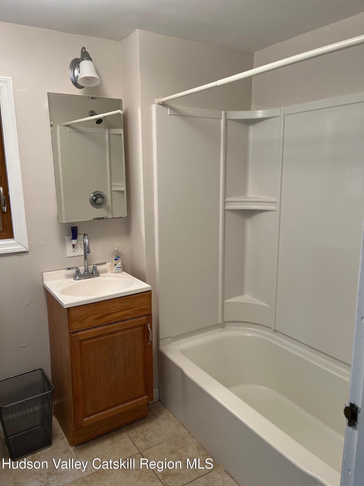 601 Fischer Road Kinderhook, NY 12106 - Photo 8 of 13 a bathroom with a tub a sink and mirror