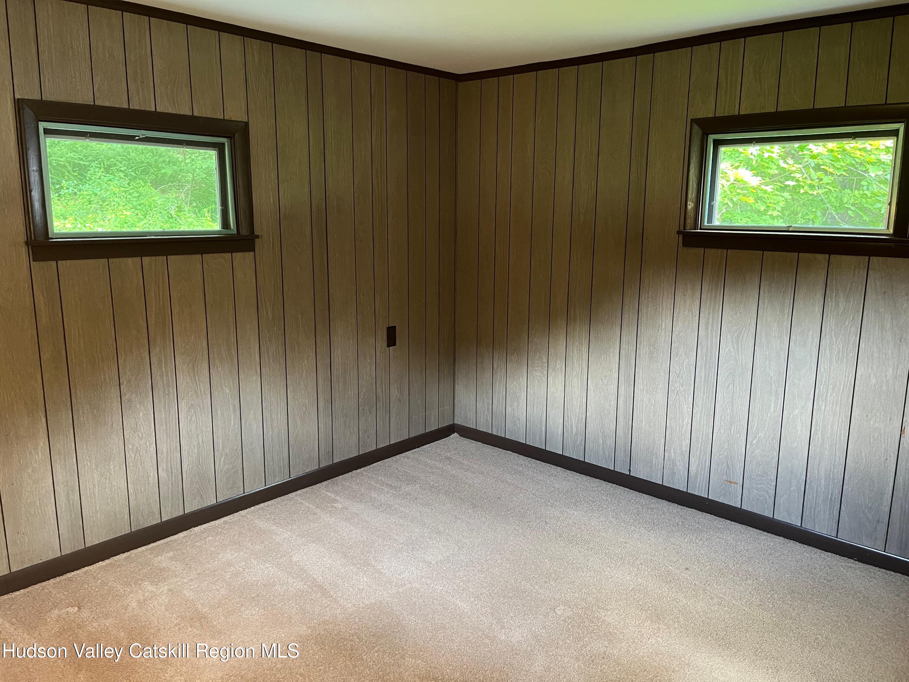 601 Fischer Road Kinderhook, NY 12106 - Photo 9 of 13 an empty room with windows grass and door