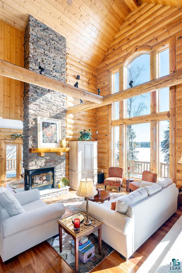 5960 North Pike Lake Road Duluth, MN 55811 - Photo 5 of 49 A floor to ceiling stacked stone, gas fireplace and 2 story windows!