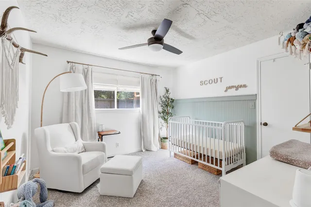 a bedroom with furniture and white walls