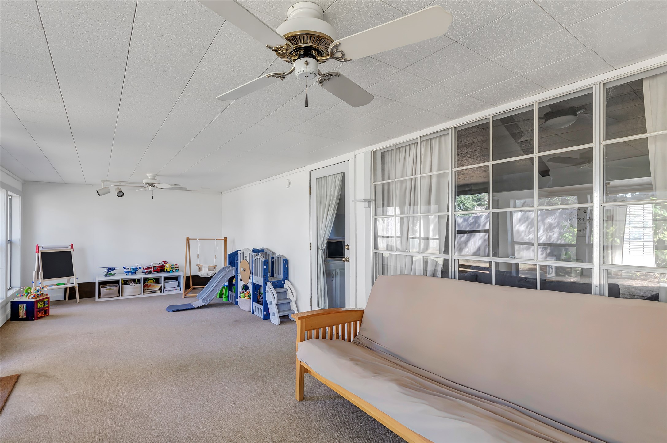 3 Baron's Place Conroe, TX 77304 - Photo 24 of 28 a living room with furniture and a large window