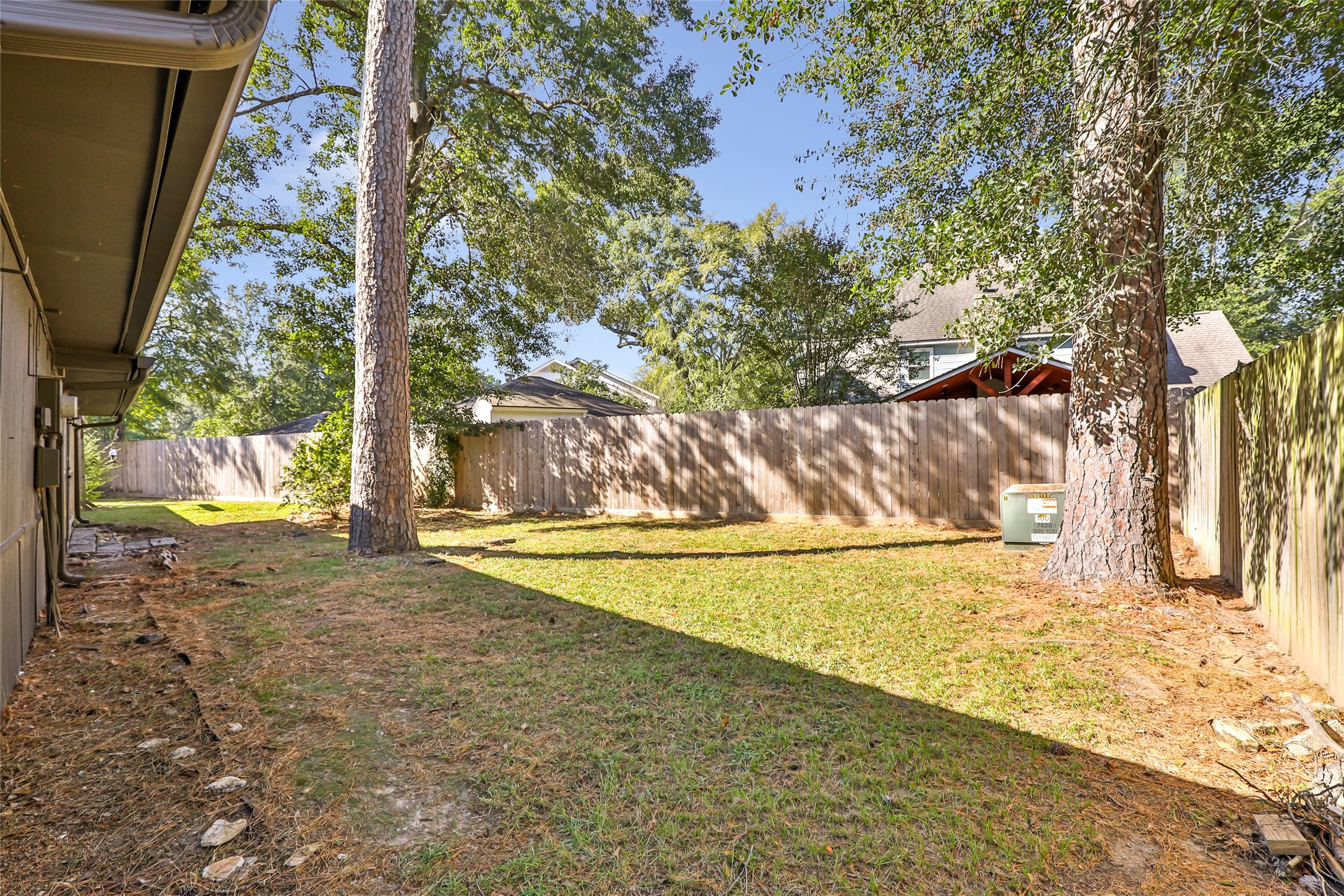 3 Baron's Place Conroe, TX 77304 - Photo 26 of 28 a view of a yard with large trees