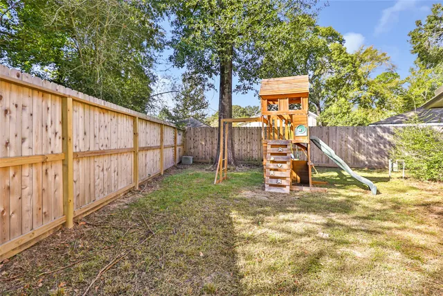 a view of outdoor space with wooden fence