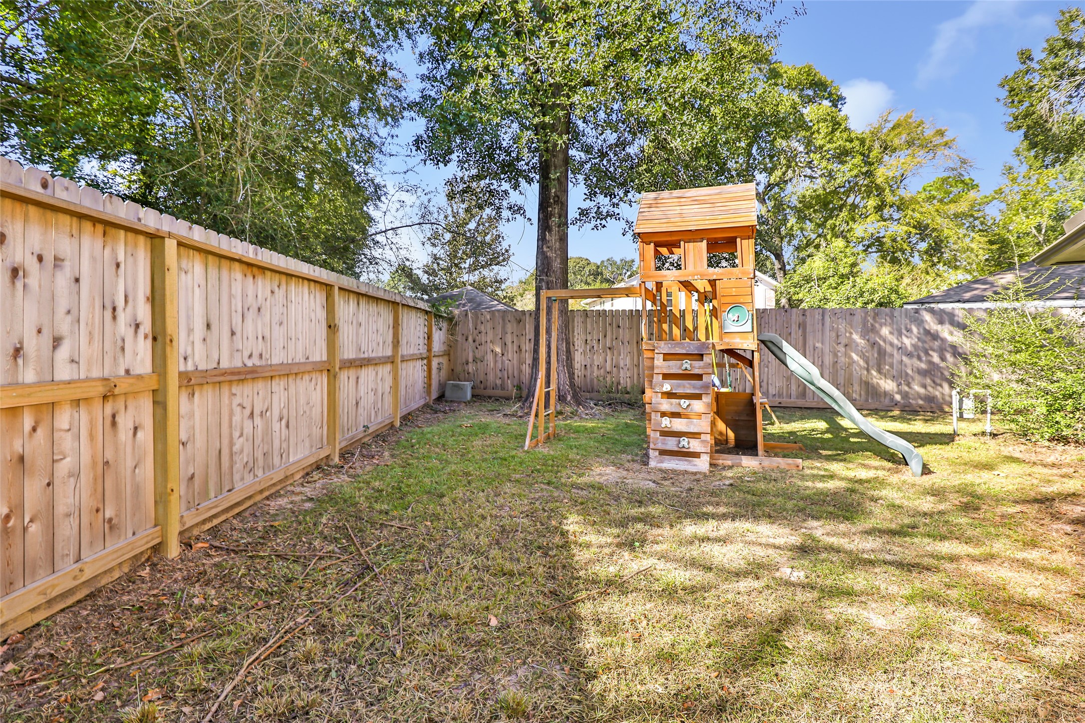3 Baron's Place Conroe, TX 77304 - Photo 28 of 28 a view of outdoor space with wooden fence