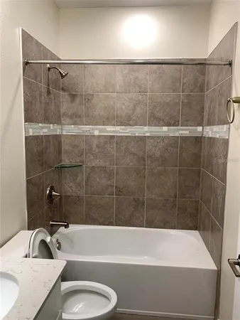 a bathroom with a bathtub and a sink