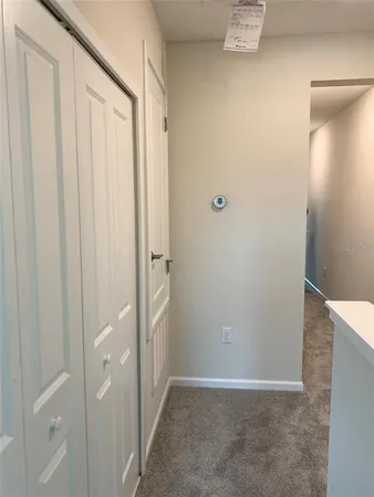 a view of a hallway with closet
