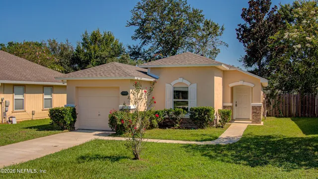 a front view of a house with a yard