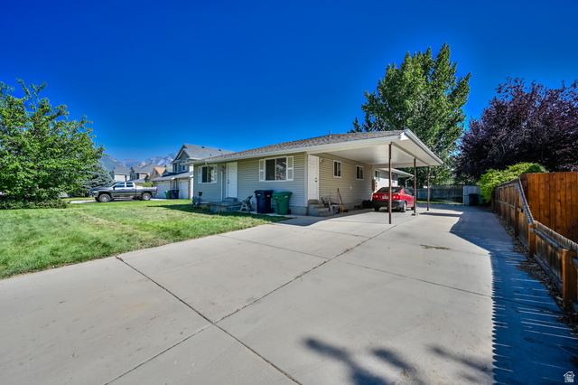 916 Vics Road, Unit 2 Sandy, UT 84094 - Photo 22 of 23 Single-story residence featuring light-toned siding and a covered carport
