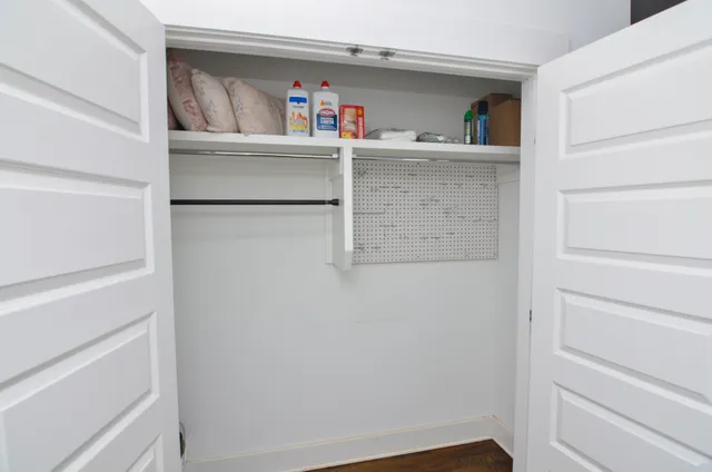 a view of an empty walk in closet