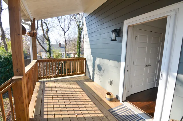 a view of balcony with wooden floor and small deck