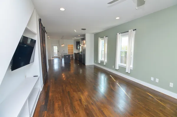 a view of gallery with wooden floor