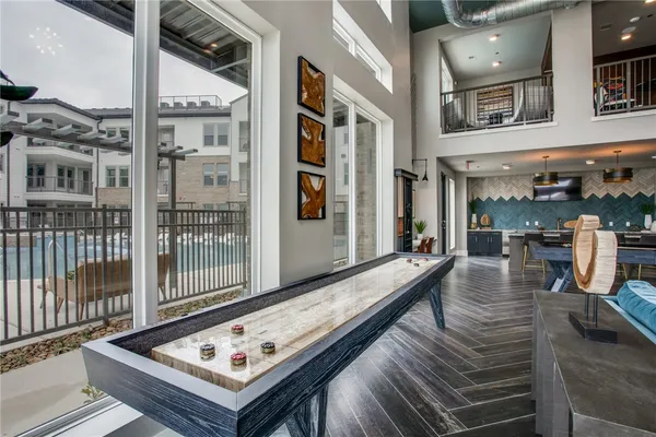 a view of a balcony and chairs with wooden floor
