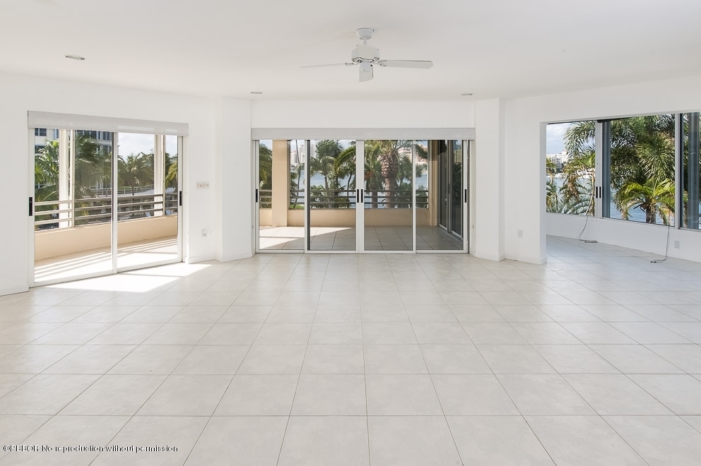 a view of an empty room with windows