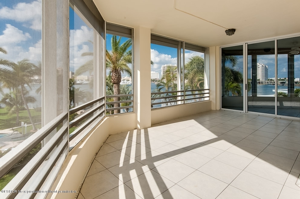44 Cocoanut Row, Unit 214A Palm Beach, FL 33480 - Photo 4 of 13 a large white building with glass windows