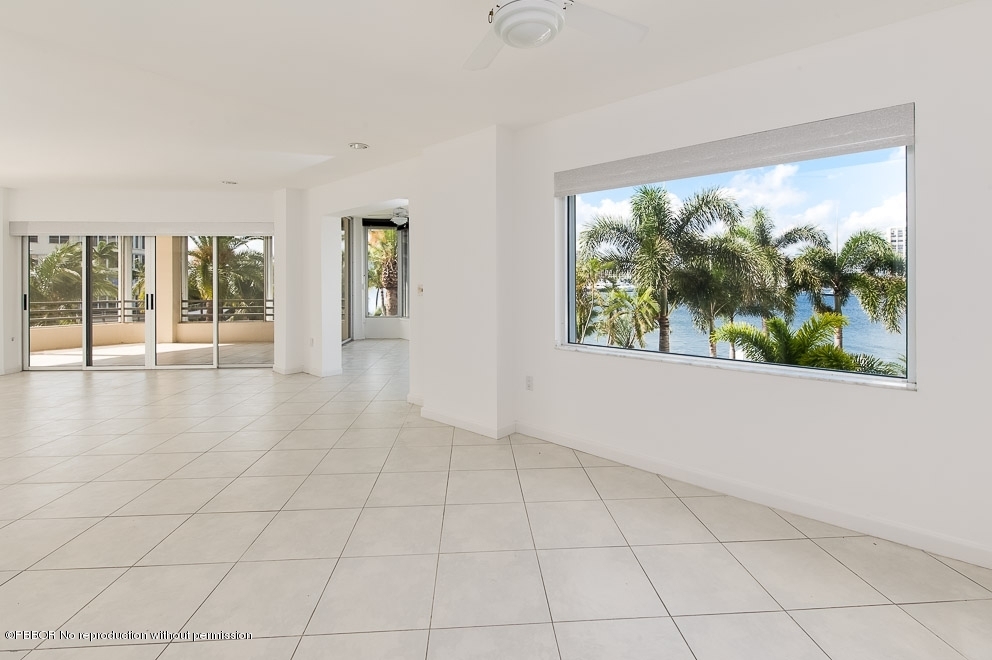44 Cocoanut Row, Unit 214A Palm Beach, FL 33480 - Photo 5 of 13 wooden floor in an empty room with a window