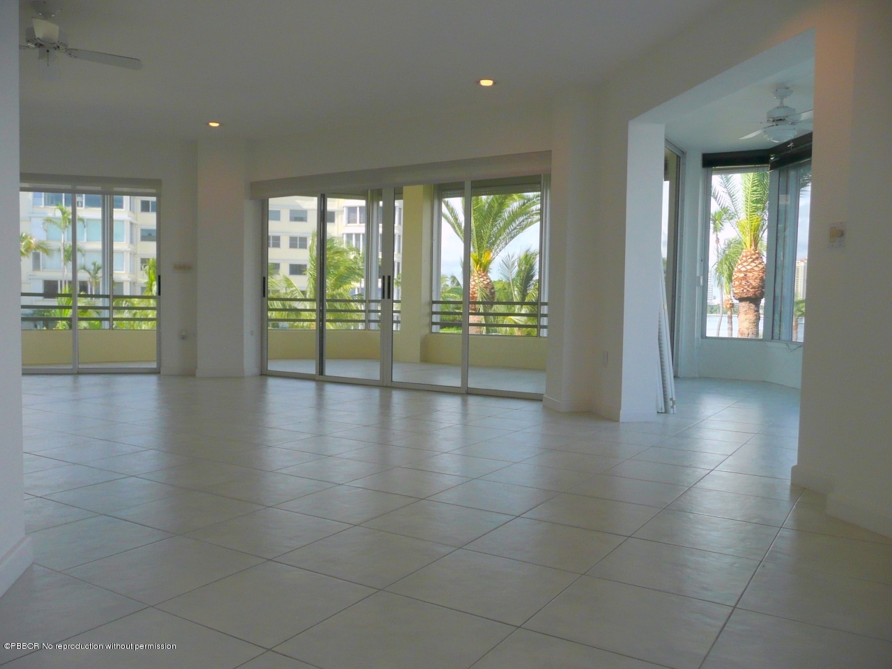44 Cocoanut Row, Unit 214A Palm Beach, FL 33480 - Photo 8 of 13 a view of an empty room with glass door and windows