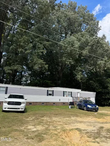 a view of a swimming pool with a yard