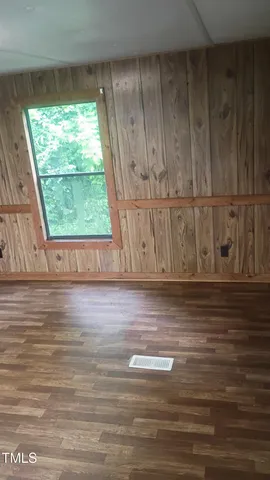 a kitchen with a sink and wooden cabinets