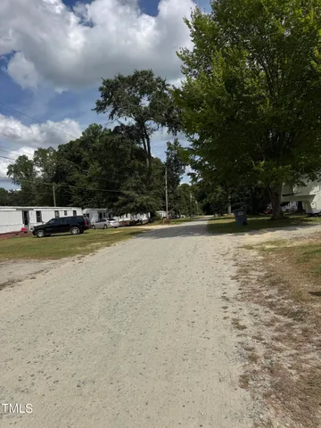 a view of a big yard next to a building