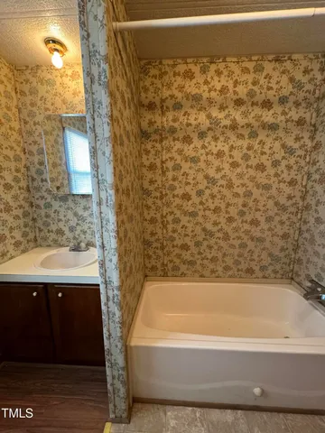 a view of a utility room with a wooden floor