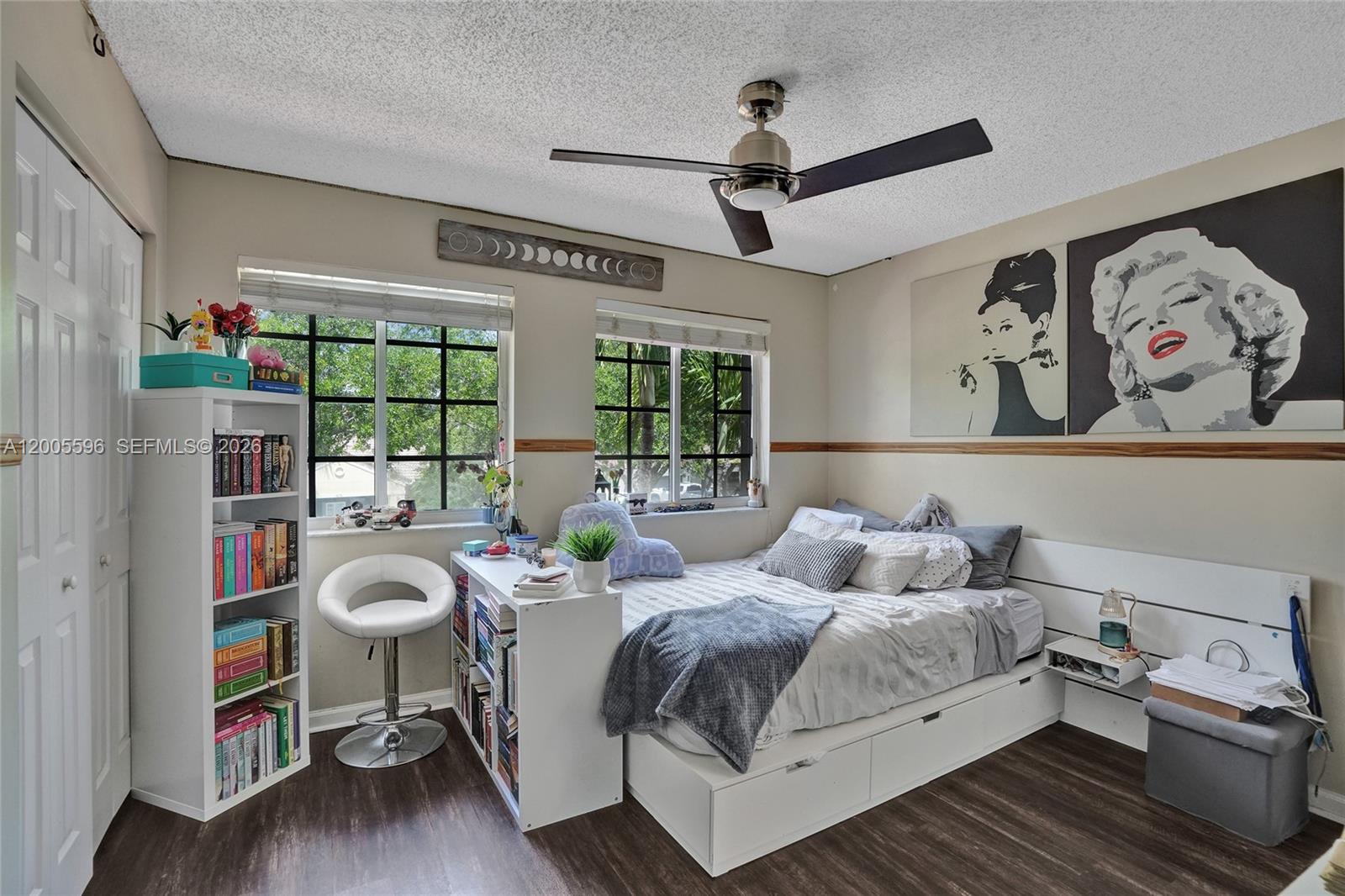 4281 Laurel Ridge Circle Weston, FL 33331 - Photo 50 of 80 a bedroom with a bed and wooden floor