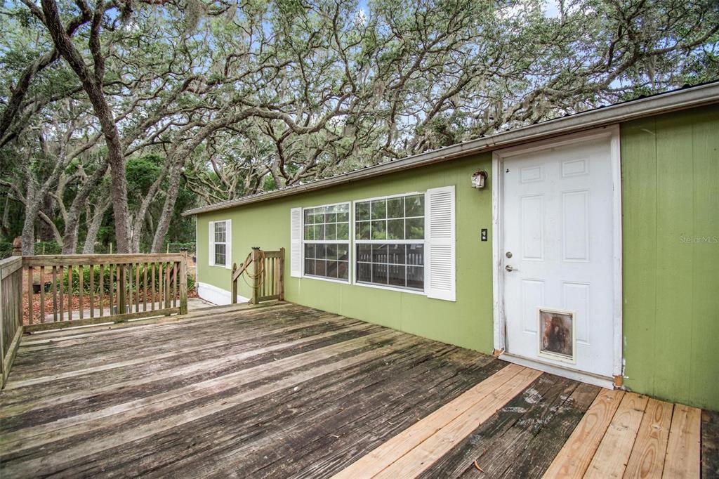 156 Kingfish Road Pomona Park, FL 32181 - Photo 6 of 55 a front view of a house with a garden