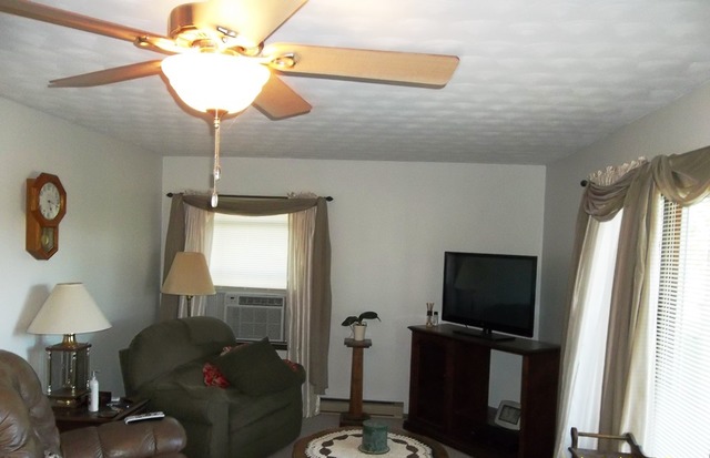 2240 Shaw Road West Brooklyn, IL 61378 - Photo 2 of 12 a living room with furniture and a flat screen tv