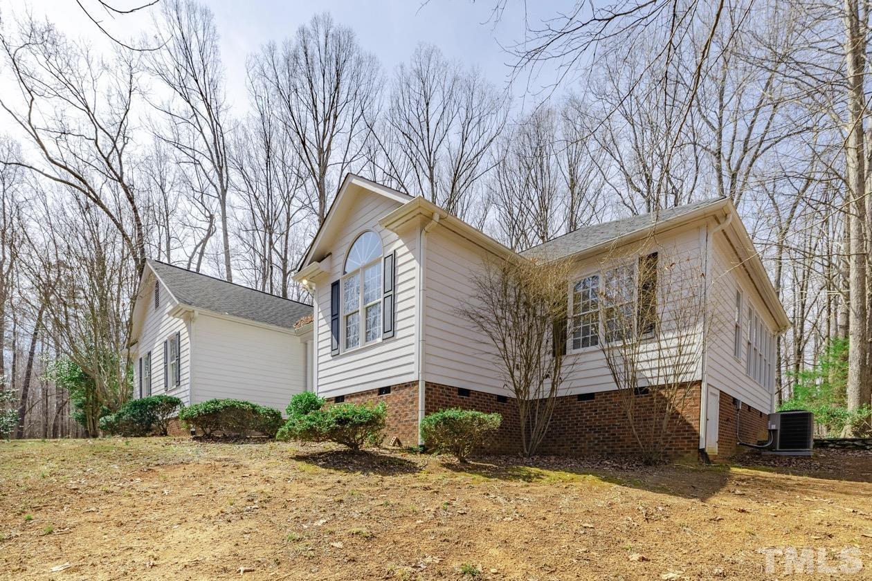 302 Shetland Road Rougemont, NC 27572 - Photo 2 of 47 a front view of a house with a yard covered with snow