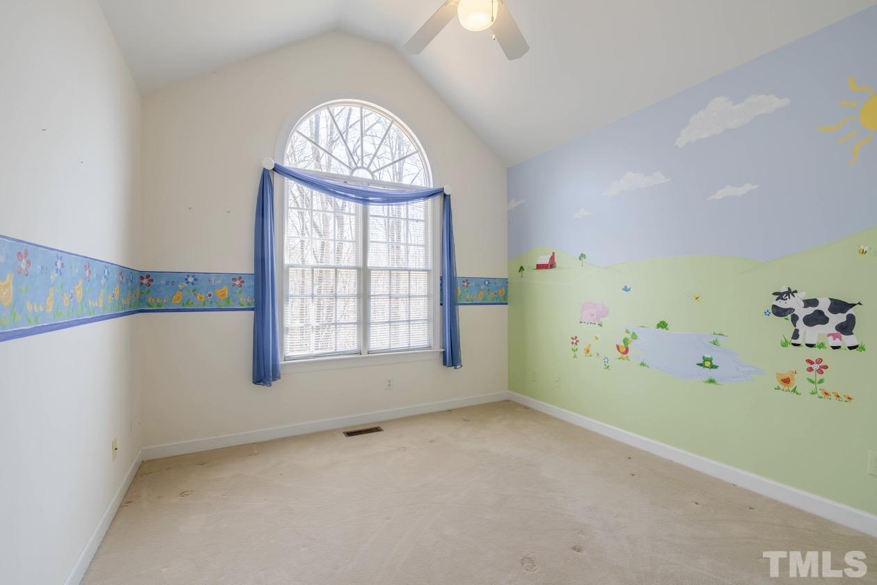 302 Shetland Road Rougemont, NC 27572 - Photo 45 of 47 an empty room with a window and a fireplace