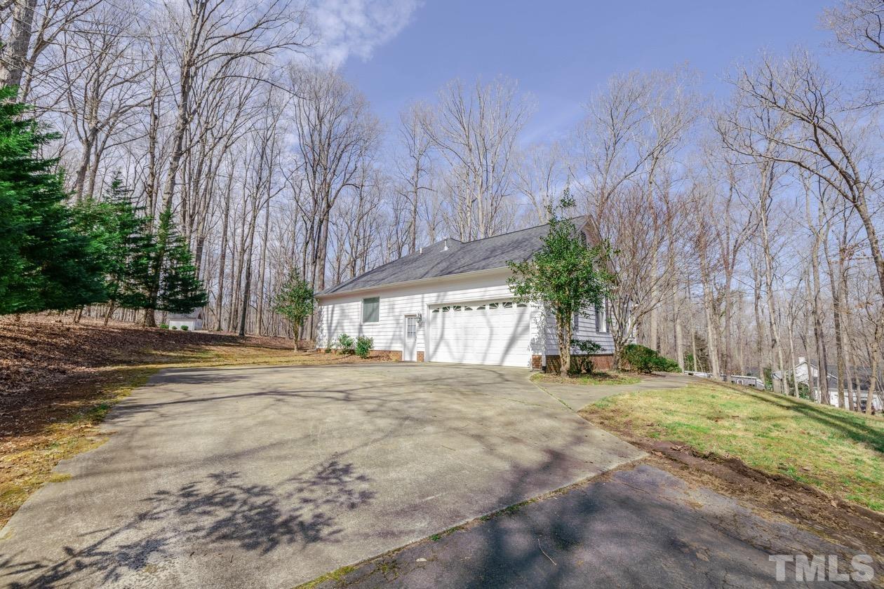 302 Shetland Road Rougemont, NC 27572 - Photo 5 of 47 a view of a yard with plants and trees
