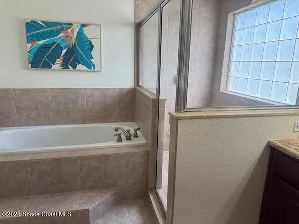 a bathroom with a bathtub and a window