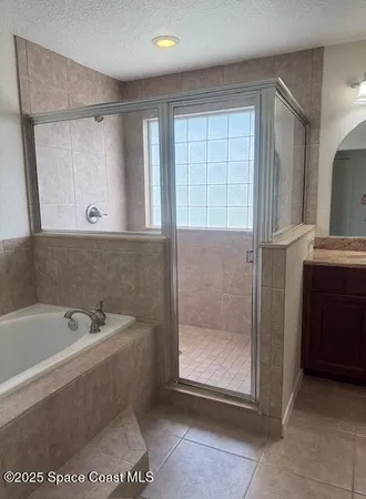 a bathroom with a bathtub and a sink