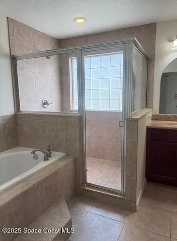 a bathroom with a bathtub and a sink