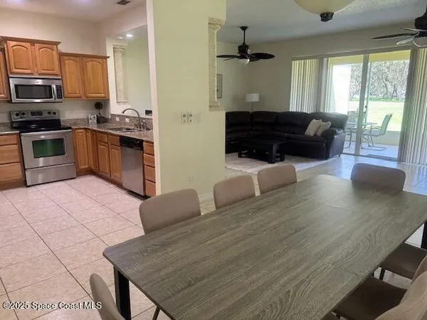 a kitchen with stainless steel appliances granite countertop a stove a sink dishwasher a microwave oven with granite countertops and cabinets