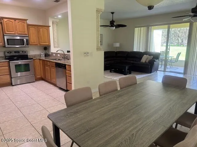 a kitchen with stainless steel appliances granite countertop a stove a sink dishwasher a microwave oven with granite countertops and cabinets