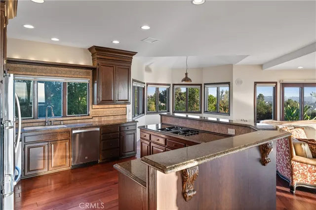 a view of an entryway with wooden floor