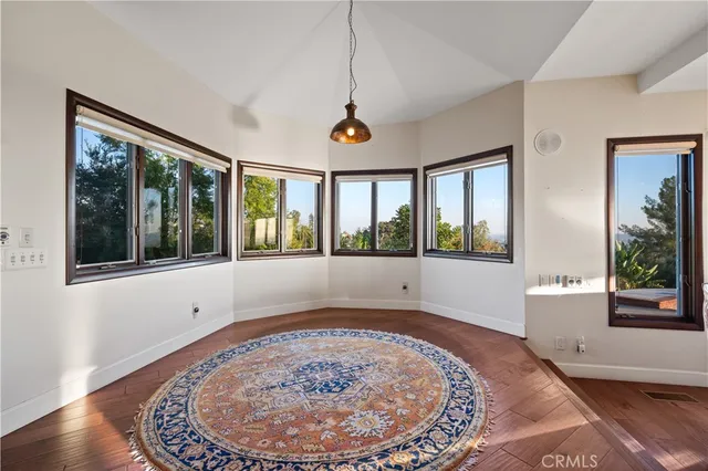 a view of a dining room with furniture window and outside view