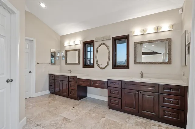 a view of a pathway with a wrought fence