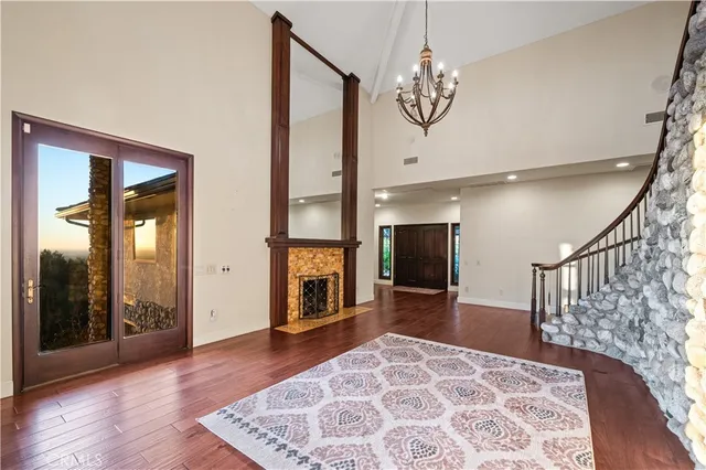 a view of an entryway with wooden floor