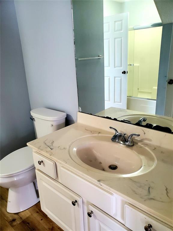 75 Atlantic Oaks Circle, Unit B St. Augustine, FL 32080 - Photo 5 of 25 a bathroom with a sink and toilet