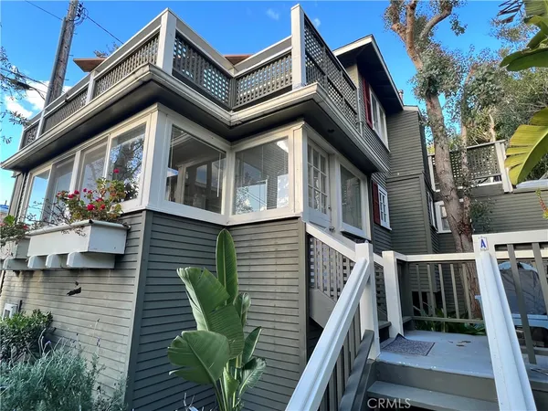 a view of a house with wooden stairs