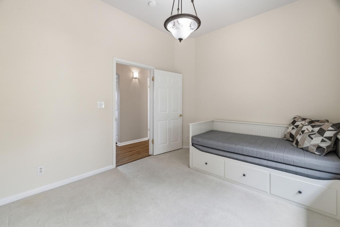 19269 Mallory Canyon Road, Unit D Salinas, CA 93907 - Photo 14 of 77 a view of an empty room with a chandelier fan