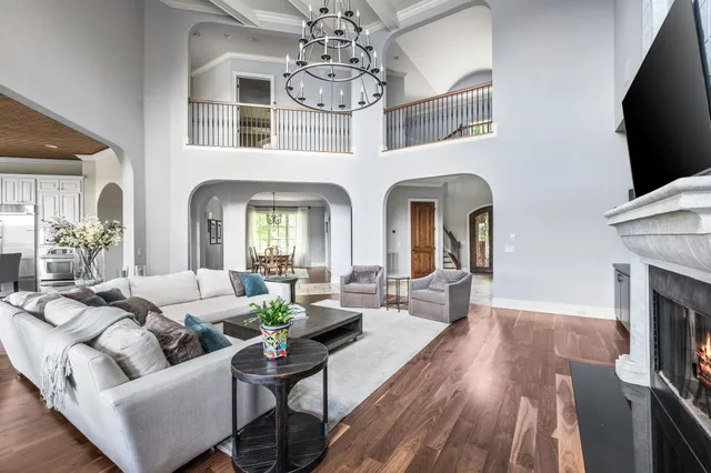 a living room with fireplace furniture and a flat screen tv